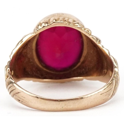 3075 - Large 9ct gold ruby solitaire ring with ornate cast setting, the ruby approximately 13.65mm x 11.70m... 