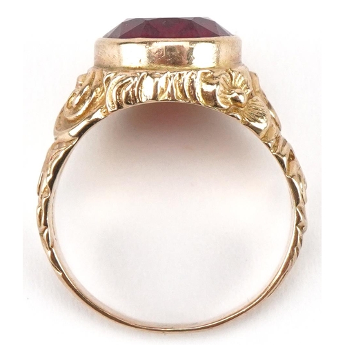 3075 - Large 9ct gold ruby solitaire ring with ornate cast setting, the ruby approximately 13.65mm x 11.70m... 