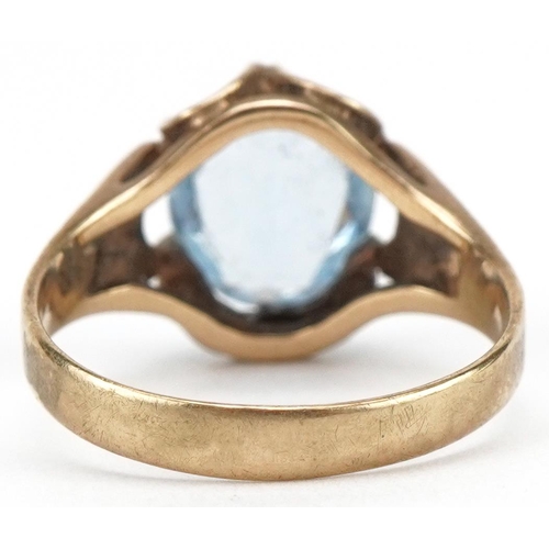 3093 - 9ct gold blue topaz solitaire ring with engine turned shoulders, the topaz approximately 10.40mm x 8... 