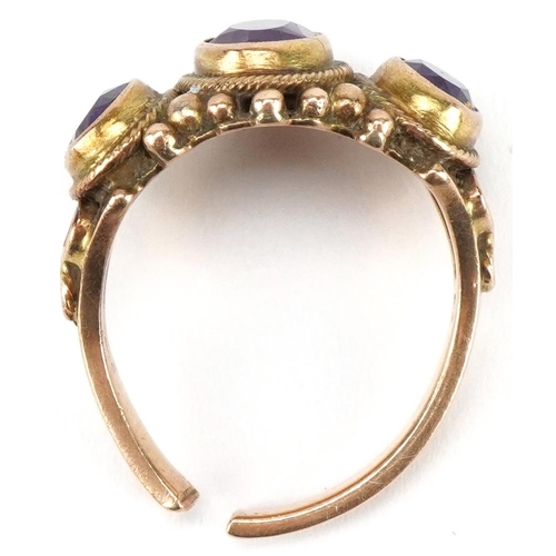 3080 - Broken unmarked gold amethyst three stone ring with ornate setting, tests as 9ct gold, 6.5g