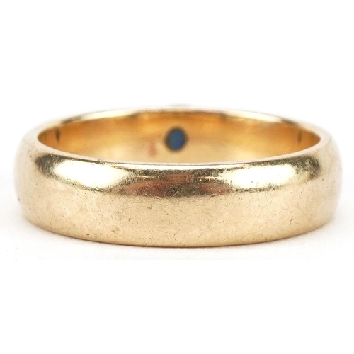 3052 - Unmarked gold sapphire and diamond three stone ring, tests as 18ct gold, size O, 4.8g