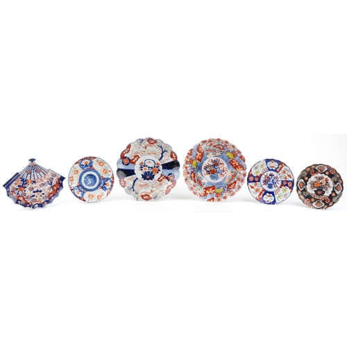 2354 - Japanese Imari porcelain comprising two chargers and four dishes, one in the shape of a fan, each ha... 