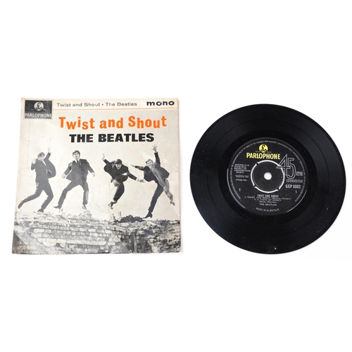 1045 - Three The Beatles 45rpm records comprising A Hard Day's Night, The Beatles Hits and Twist and Shout