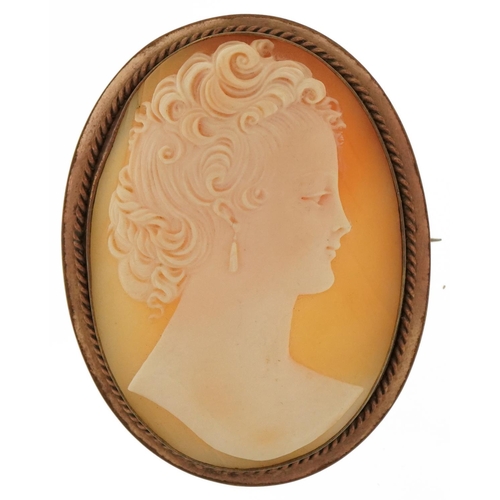 3072 - Large cameo shell brooch carved with a maiden head housed in a gilt metal mount, 5.5cm high, 17.2g