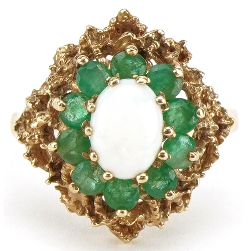 3095 - 9ct gold cabochon opal and emerald four tier cluster ring with pierced setting, size Q, 4.4g