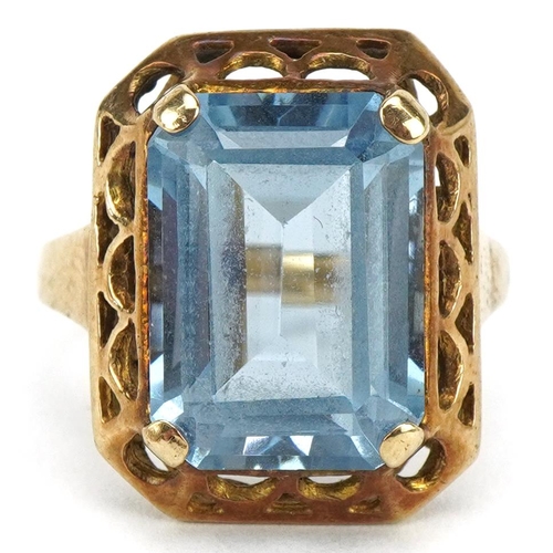 3406 - Gold baguette cut blue topaz ring with pierced setting, the topaz approximately 14.0mm x 10.20mm x 6... 