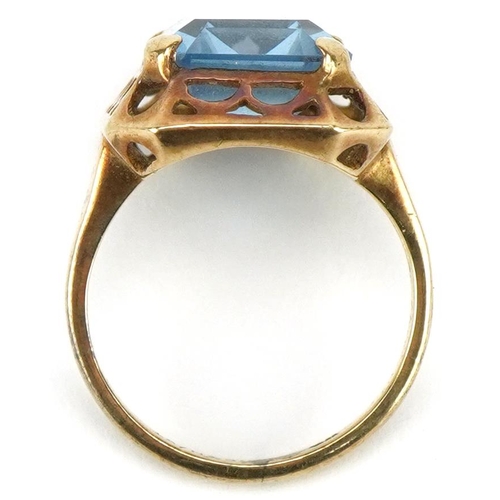 3406 - Gold baguette cut blue topaz ring with pierced setting, the topaz approximately 14.0mm x 10.20mm x 6... 