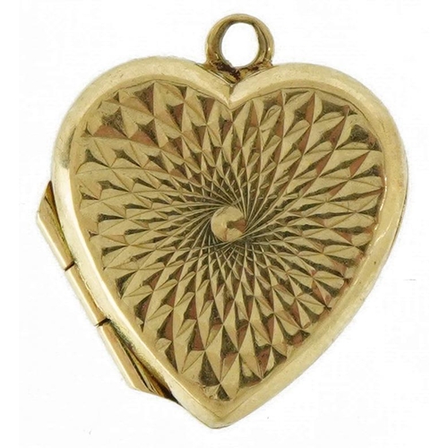 3574 - 9ct gold engine turned love heart locket, 1.6cm high, 1.5g