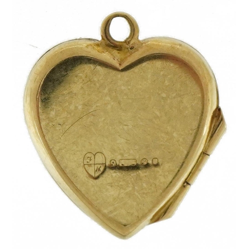 3574 - 9ct gold engine turned love heart locket, 1.6cm high, 1.5g