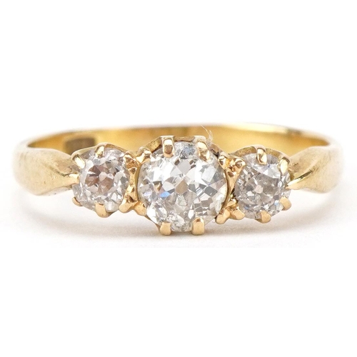 18ct gold diamond three stone ring, total diamond weight approximately 0.80 carat, size P, 2.9g