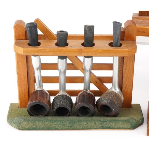 1297 - Nineteen vintage aluminium and briar tobacco smoking pipes arranged in four gate design pipe racks i... 