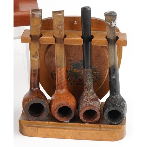 1273 - Nineteen vintage briar tobacco smoking pipes, some Italian, arranged in four pipe racks, three in th... 