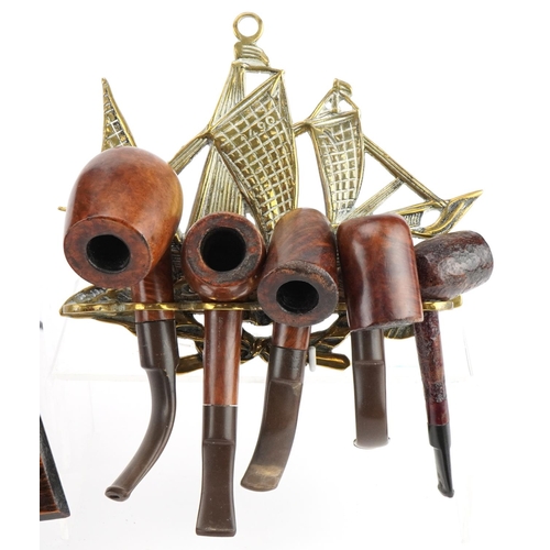 1282 - Twenty two vintage briar tobacco smoking pipes arranged in four wall hanging pipe racks, two with Sm... 