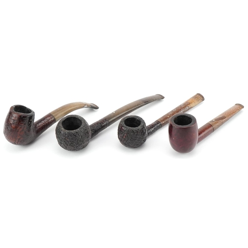 1258 - Four Dunhill briar tobacco smoking pipes arranged in a gate design pipe rack including Shell briar, ... 