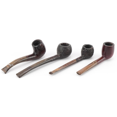 1258 - Four Dunhill briar tobacco smoking pipes arranged in a gate design pipe rack including Shell briar, ... 