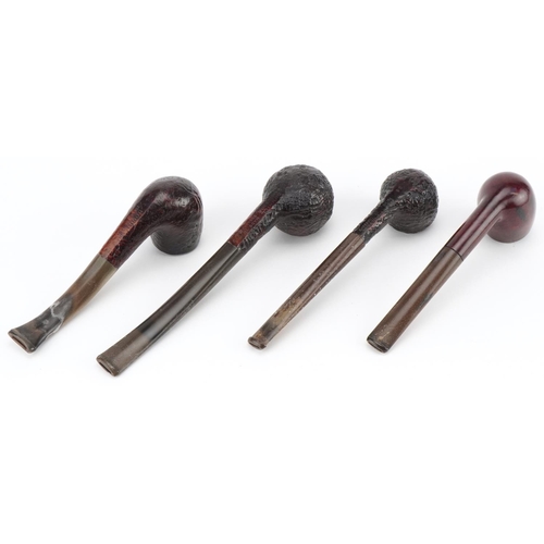 1258 - Four Dunhill briar tobacco smoking pipes arranged in a gate design pipe rack including Shell briar, ... 