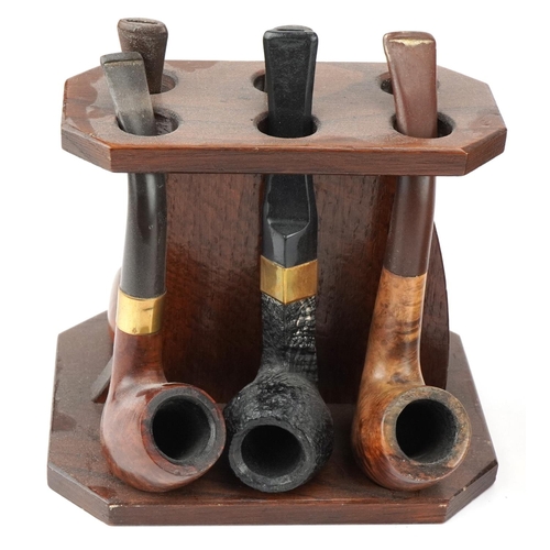 1268 - Twenty vintage briar tobacco smoking pipes including three with silver mounts arranged in four pipe ... 