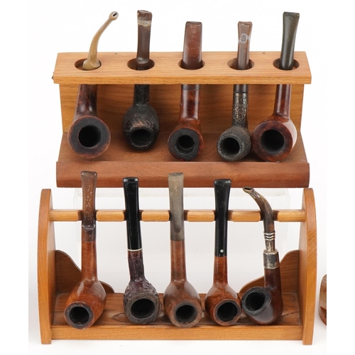 1268 - Twenty vintage briar tobacco smoking pipes including three with silver mounts arranged in four pipe ... 