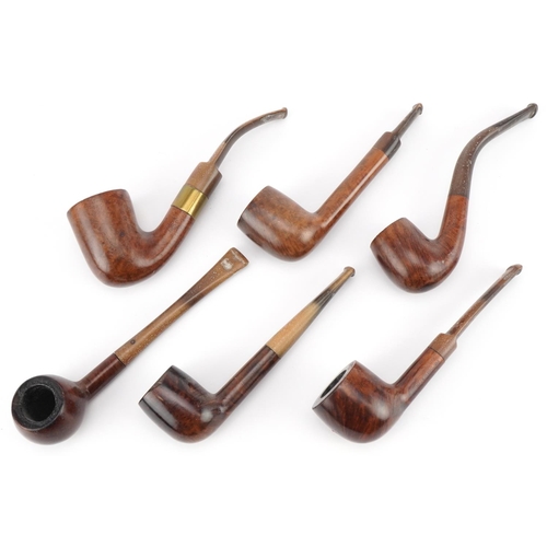 1261 - Six vintage Orlik Deluxe tobacco smoking pipes arranged in a lightwood pipe rack, the rack 28cm wide