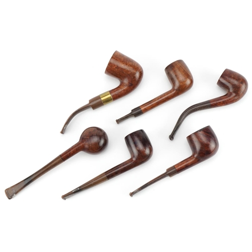 1261 - Six vintage Orlik Deluxe tobacco smoking pipes arranged in a lightwood pipe rack, the rack 28cm wide