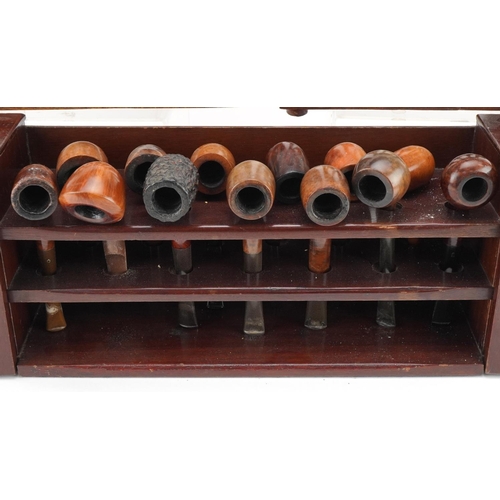 1265 - Twenty three vintage tobacco smoking pipes, predominantly briar, arranged in three pipe racks includ... 