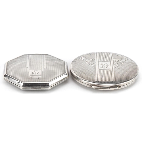 128 - Two Art Deco style silver engine turned compacts, the largest 6.8cm in diameter, total 152.0g