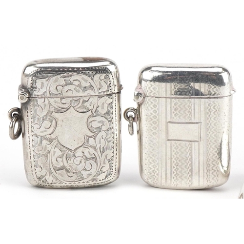 164 - Two Edwardian and later silver vestas and a silver match case with gilt interior, the largest 6cm in... 