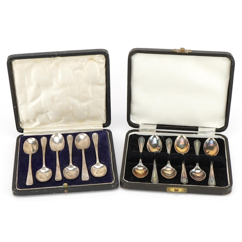 499 - Two sets of six silver teaspoons with velvet and silk lined fitted cases, the largest 11.5cm in leng... 