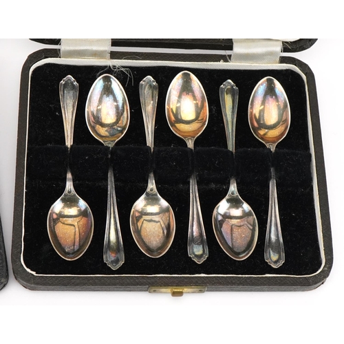 499 - Two sets of six silver teaspoons with velvet and silk lined fitted cases, the largest 11.5cm in leng... 