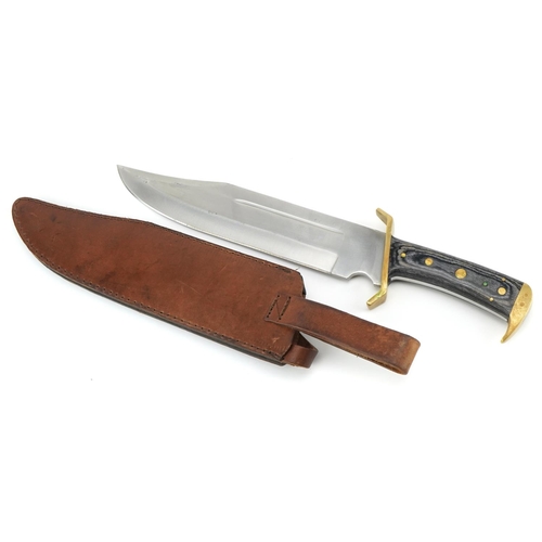 1422 - Bowie type knife with leather sheath, steel blade and marbleised handle, 44.5cm in length