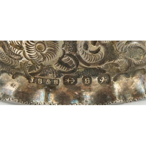 690 - J Sherwood & Sons, pair of Victorian silver napkin rings embossed with flowers and foliage, housed i... 