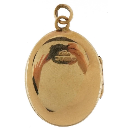 3351 - 9ct gold engraved locket, 2.5cm high, 4.2g