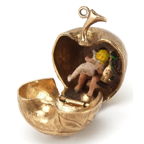 3087 - 9ct gold engraved apple charm opening to reveal an enamelled study of Adam & Eve and a snake on a br... 