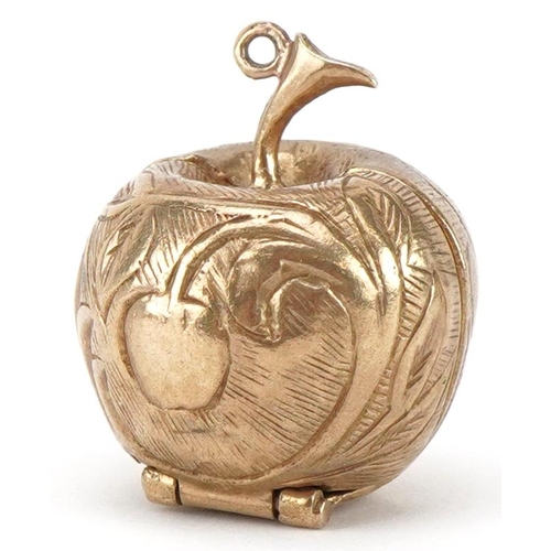 3087 - 9ct gold engraved apple charm opening to reveal an enamelled study of Adam & Eve and a snake on a br... 