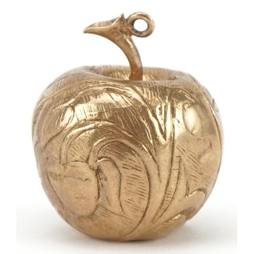 3087 - 9ct gold engraved apple charm opening to reveal an enamelled study of Adam & Eve and a snake on a br... 