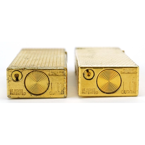 619 - Two Dunhill gold plated pocket lighters with engine turned bodies