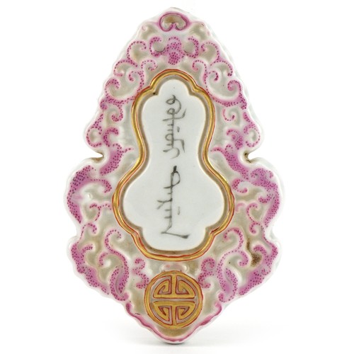 725 - Chinese porcelain pendant with gourd motif hand painted with calligraphy, 7cm in length