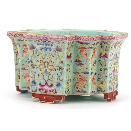 306 - Chinese porcelain four footed planter having a turquoise glaze hand painted in the famille rose pale... 