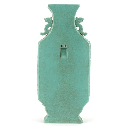 390 - Chinese porcelain wall vase with animalia handles having a turquoise glaze hand painted with calligr... 