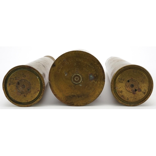 1397 - Three military interest trench shells including a pair, the largest each 31cm high