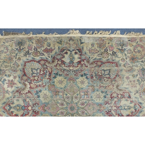 2198 - Rectangular cream ground rug having an all over floral design, 300cm x 165cm