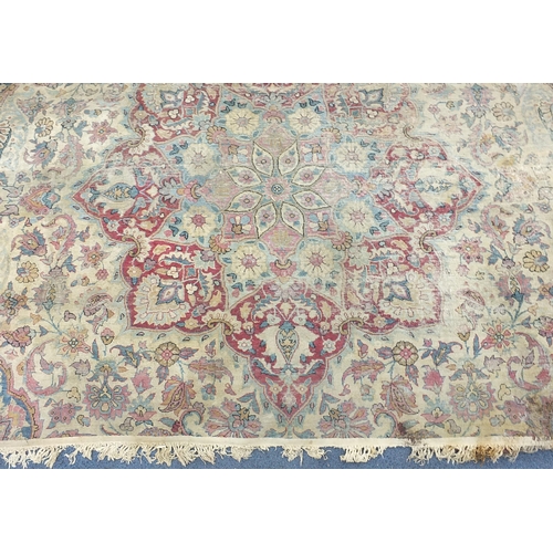 2198 - Rectangular cream ground rug having an all over floral design, 300cm x 165cm