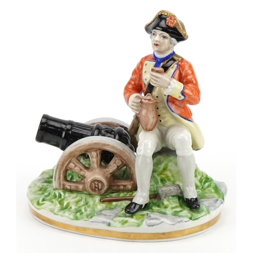 2450 - Naples porcelain figure of a Napoleonic soldier sitting beside a cannon, 17.5cm wide