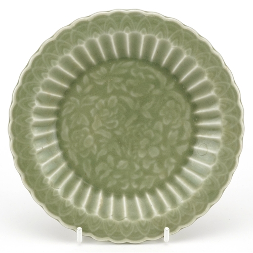 2590 - Chinese porcelain dish having a celadon glaze decorated under glaze with flowers, 15cm in diameter