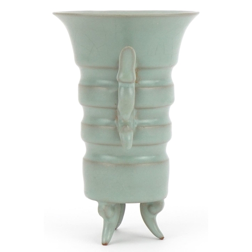 2528 - Chinese porcelain tripod vase with twin handles having a celadon glaze, 15.5cm high