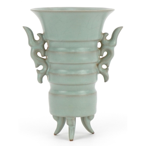 2528 - Chinese porcelain tripod vase with twin handles having a celadon glaze, 15.5cm high