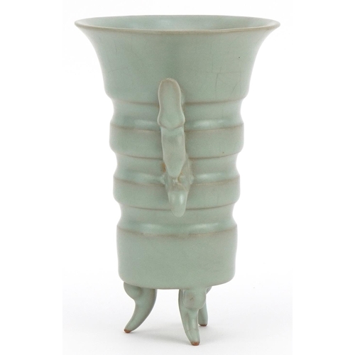 2528 - Chinese porcelain tripod vase with twin handles having a celadon glaze, 15.5cm high