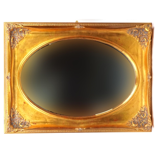 2173 - 19th century style gesso design wall mirror with oval aperture, 112cm x 80cm