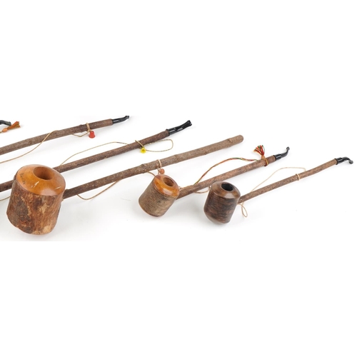 1317 - Eight large European briar tobacco smoking pipes, the largest 75cm in length