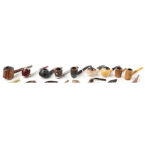 1283 - Twenty five vintage tobacco smoking pipes, one with silver mounts, some briar, including Wilson & Co... 